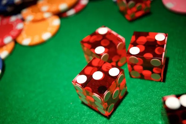 Starburst slot game interface on mobile showing five reels with jewel symbols and payout table